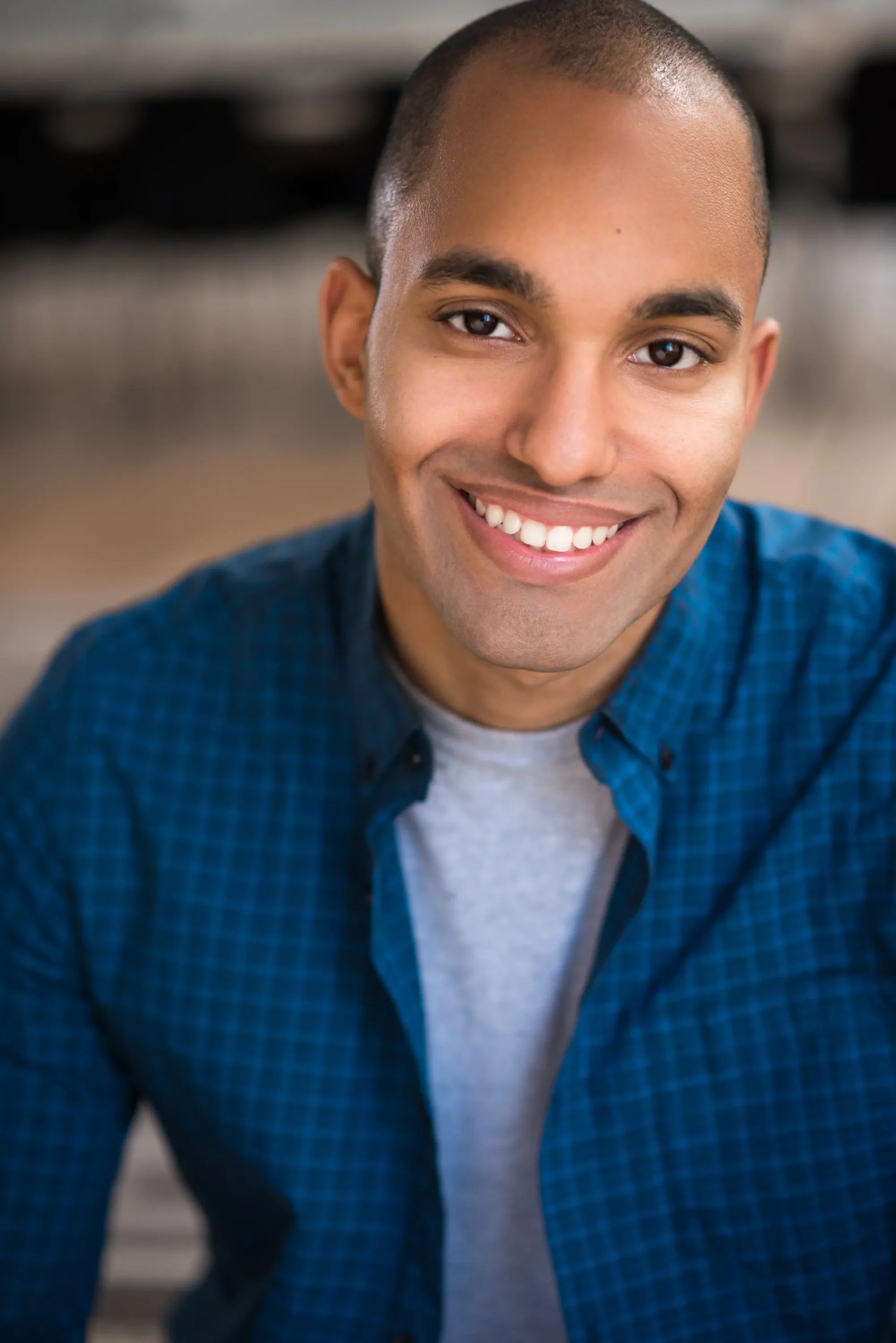 Amilcar Javier, smiling commercial headshot